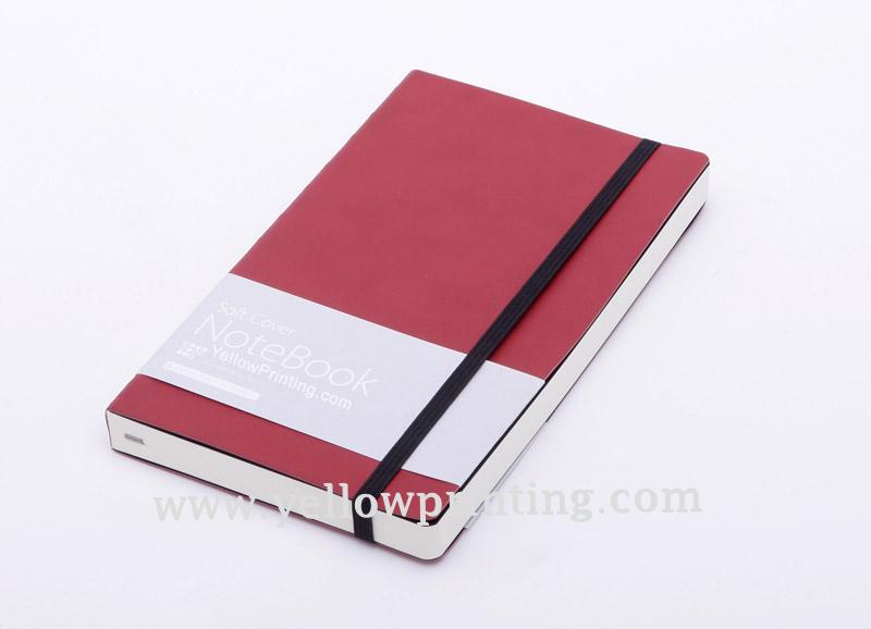 Paper back notebook with elastic band